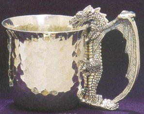 hammered pewter cup with dragon as handle looking into cup