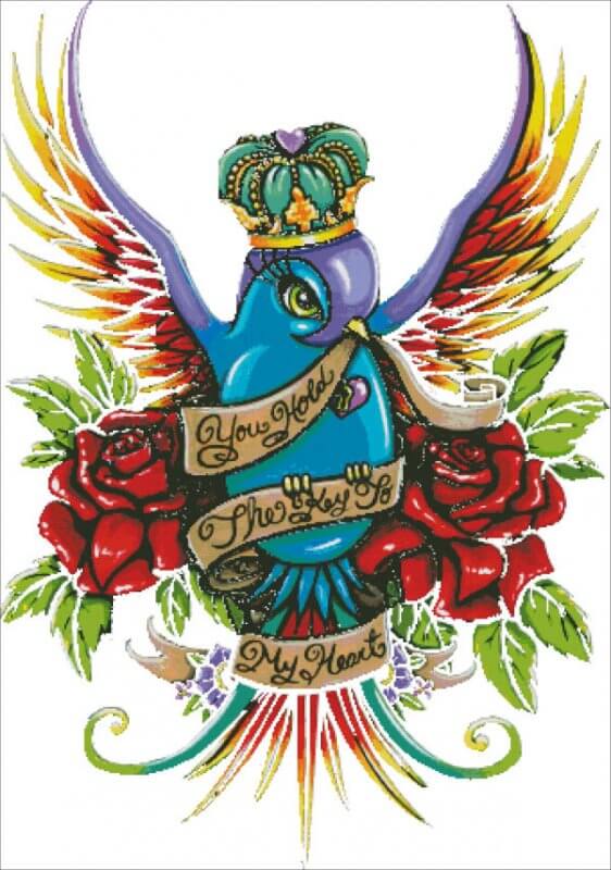 Mockup of cross stitch, art by Myka Jelina. The artwork shows off a bright and bold bird, topped with a crown and surrounded by roses. A banner it holds in its beak reads, "You Hold The Key To My Heart".