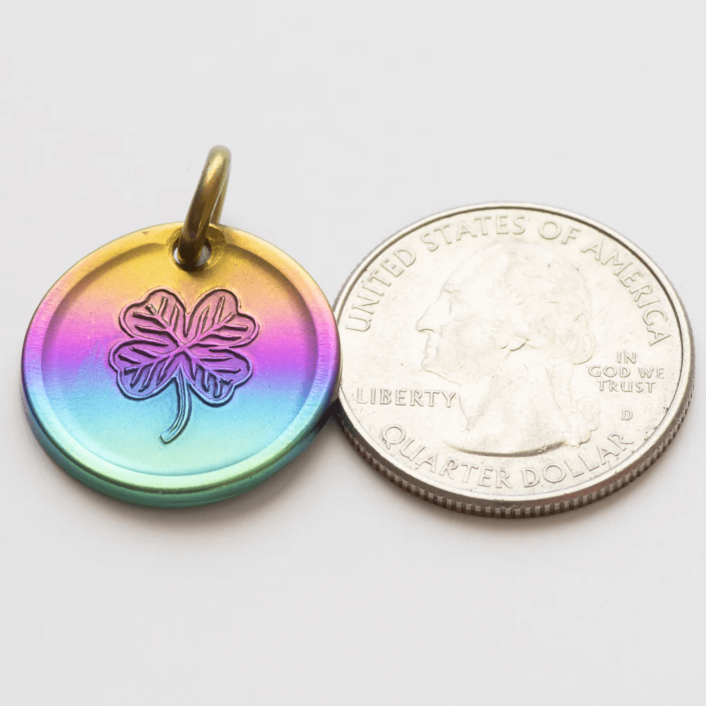 Rainbow lucky coin charm showing US quarter for scale
