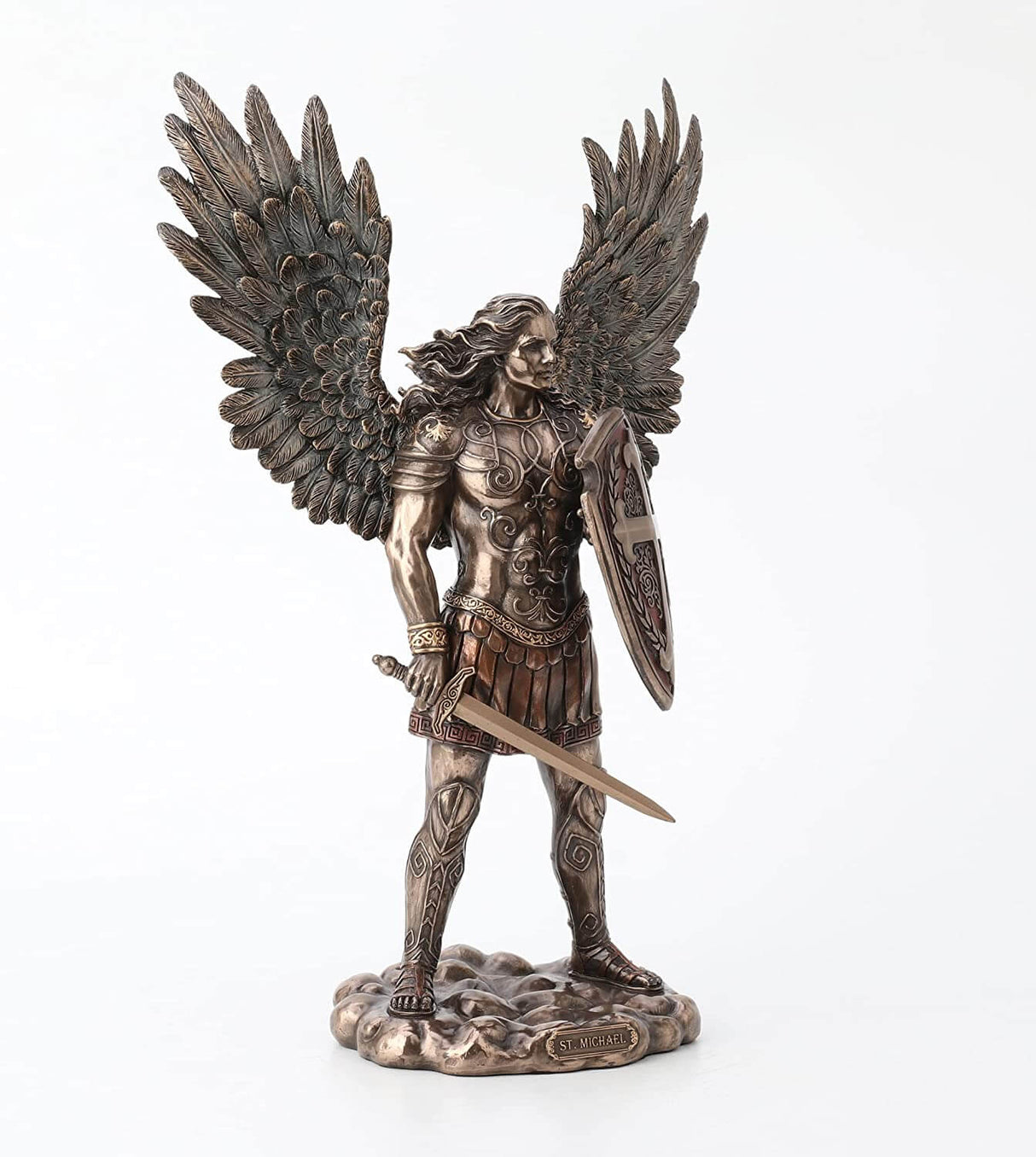 Saint Michael the archangel clad in battle armor with sword and shield and feathered wings, long hair blowing behind him
