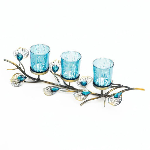 Trio of three blue candleholders on a peacock feather inspired jeweled base