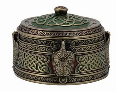Side view of Celtic trinket box. Dark red and green with bronze-gold knotwork