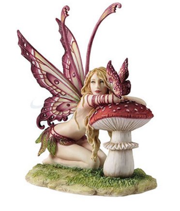he pixie is clad in a skirt of leaves and has ornately detailed butterfly wings that match her little friend, a butterfly. They sit on a mushroom. Based on the art of Selina Fenech