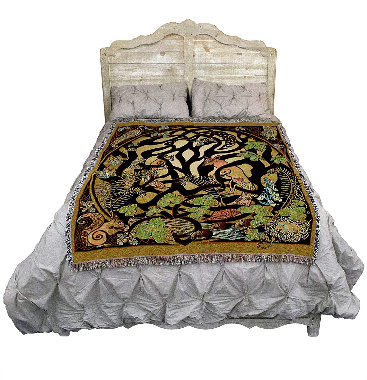 Foxes and woodland animals twine around a Celtic knotwork tree pattern on this tapestry throw blanket. Displayed on a grey bed