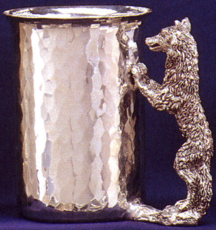 pewter cup with wolf standing with limbs attached to cup for handle