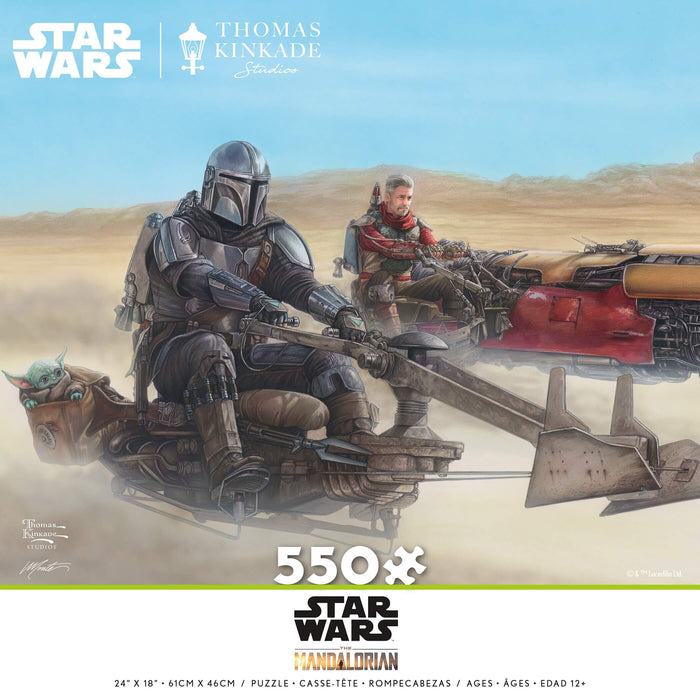 550 piece jigsaw puzzle from Star Wars: The Mandalorian with art by Thomas Kinkade. Mando, Grogu, and Cobb Vanth on speeder bikes racing across the Tatooine sands