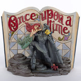 Figurine of Little Mermaid and Prince Eric statue with Sebastian the crab and Flounder against a storybook background