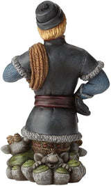 Figurine of Kristoff from Disney's Frozen, showing his bust surrounded by friendly stone trolls. Shown from the back