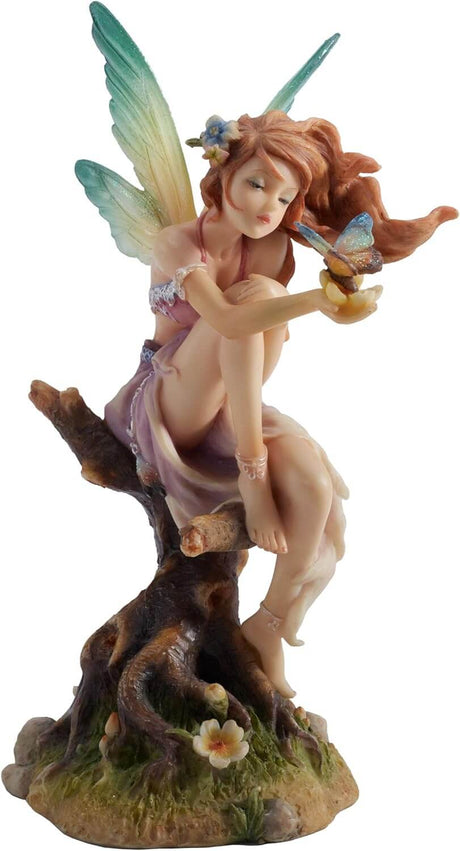 Figurine of a fairy leaning towards the butterfly on her hands. Red hair, green tipped wings, pink dress, sitting on a tree stump.