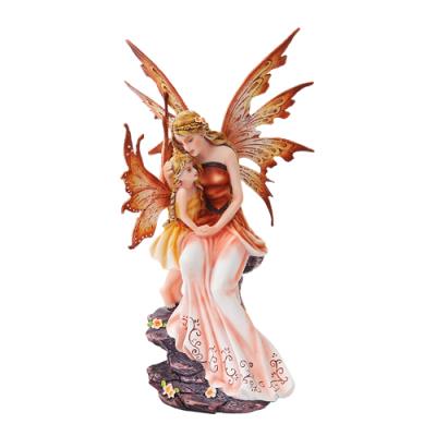 Peach-hued mother and child fairy figurine