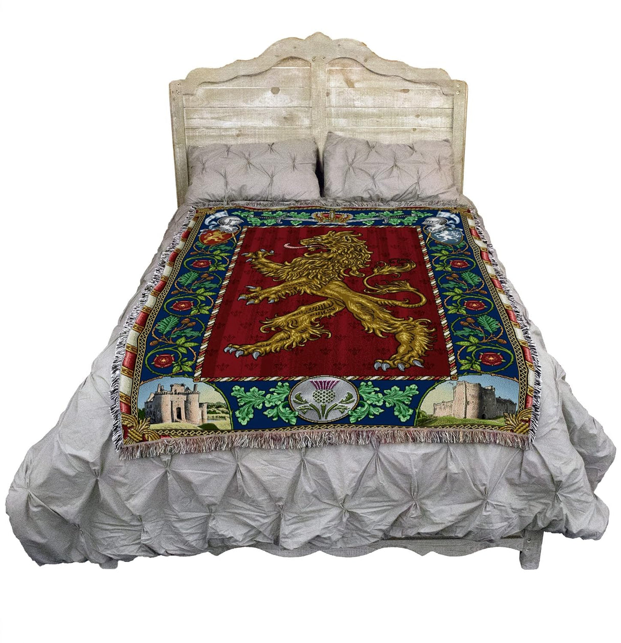 Bed with a decorative blanket featuring a lion emblem on a red background.