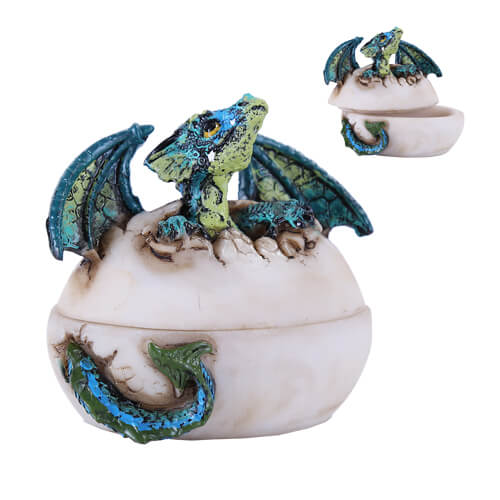 Trinket box shaped like an egg with a blue green dragon hatching