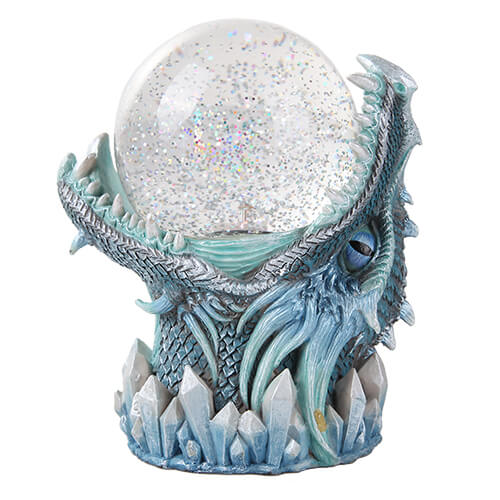 Blue dragon jaws grasping a glitter filled snowglobe. White and blue crystals on the base