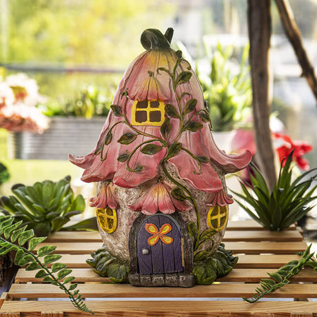 Fairy house figurine garden accent with LED inside, pink flower roof