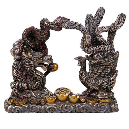 Figurine of an Asian dragon and phoenix surrounded by coins