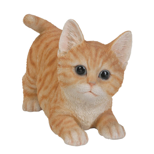 Figurine of an orange tabby kitten ready to pounce