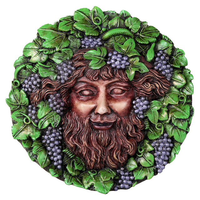Round decorative wall plaque featuring a classical male face - the god Bacchus - surrounded by green leaves and clusters of purple grapes
