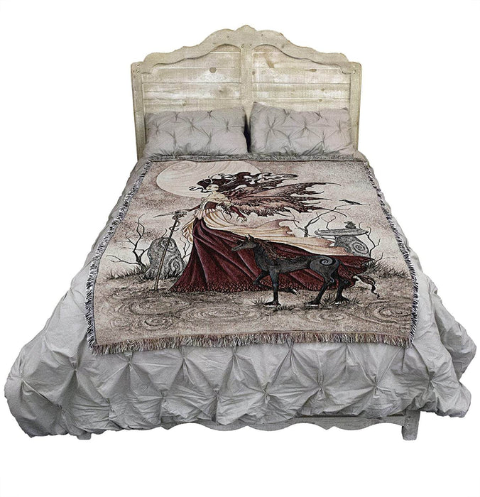 Tapestry blanket shown on bed