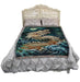 Moon and Sea Dragon tapestry shown on a bed