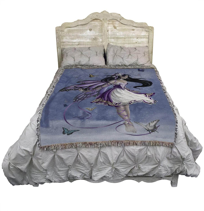 Violet Melody fairy blanket shown on a bed