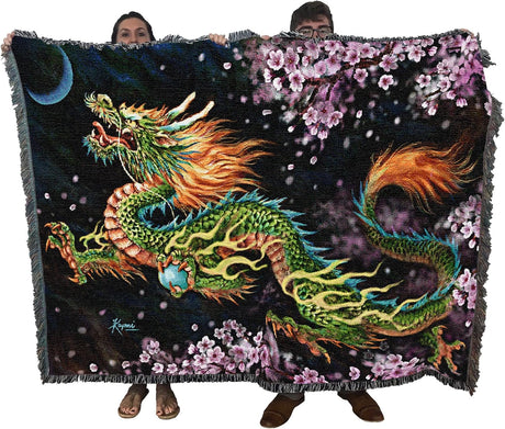 Tapestry blanket held by two adults to show large size