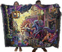 Tapestry blanket held by two adults to show large size