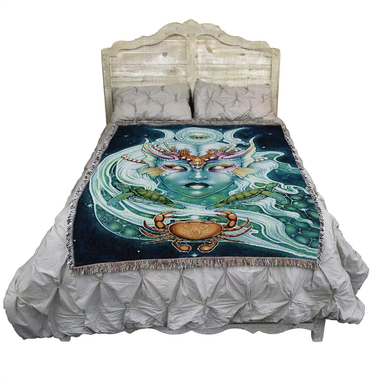Tapestry blanket with face of nautical goddess, moon phases, turtles and crab, on bed to show size