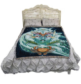 Tapestry blanket with face of nautical goddess, moon phases, turtles and crab, on bed to show size