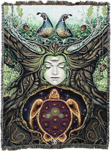 Woven tapestry with a stylized face, birds, and a turtle in a natural setting