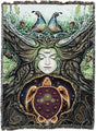 Woven tapestry with a stylized face, birds, and a turtle in a natural setting