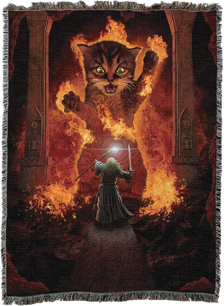 Woven blanket with a fantasy design featuring a cat wreathed in fire, reminiscent of the Balrog from Lord of the Rings, facing off with a wizard much like Gandalf.