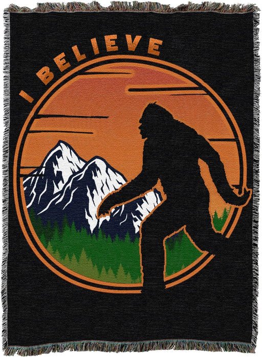 Tapestry blanket - Bigfoot silhouette against mountains with orange, text "I BELIEVE"