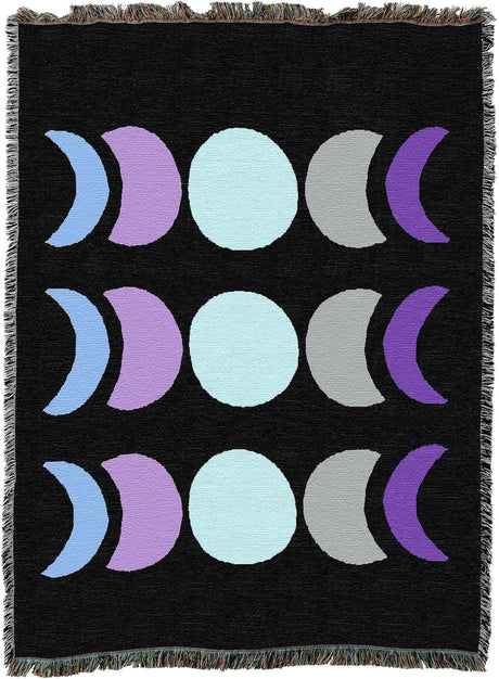 Tapestry blanket with phases of the moon, waxing, waning, full in blue, purple, gray on black. Three lines with 5 moons each