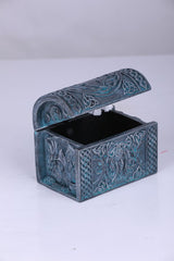 Decorative blue gray box with intricate patterns on a white background