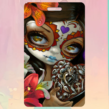 Bag tag with girl in face paint holding heart, surrounded by lily flowers