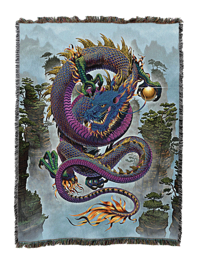Colorful purple dragon design on a woven blanket with a scenic background