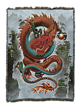 Woven blanket with a colorful red dragon design on a scenic background