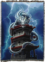 Tapestry blanket with Asian style dragon on a pagoda tower with lightning