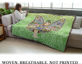 Woman sitting on a couch with a colorful fairy-themed blanket, text 'Woven, Breathable, Not Printed' displayed.