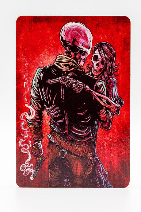 Magnet showing skeleton couple embracing, each holding a gun, with red background