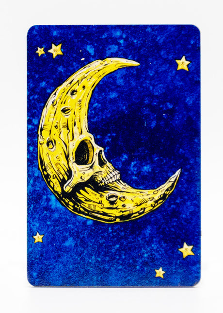 Magnet of a bright yellow skeletal moon and stars on a mottled blue background