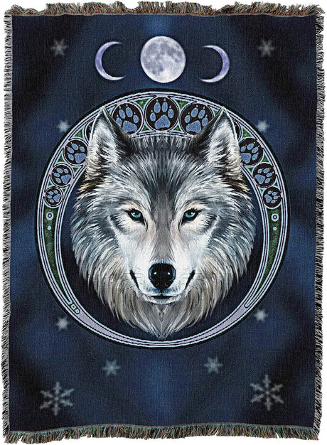 Woven blanket with a wolf design and moon phases on a dark blue background
