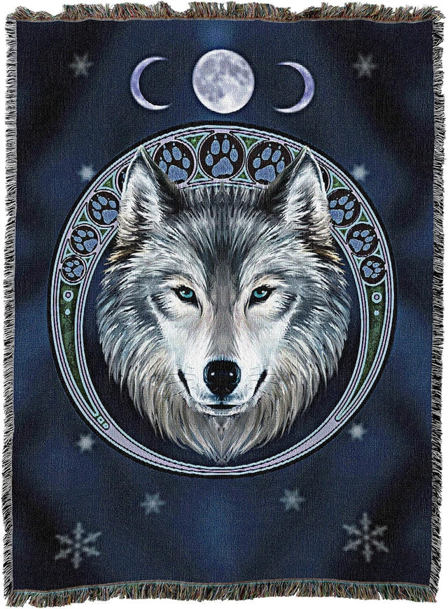 Woven blanket with a wolf design and moon phases on a dark blue background
