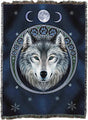 Woven blanket with a wolf design and moon phases on a dark blue background
