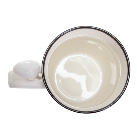 Inside of ceramic mug with spoon