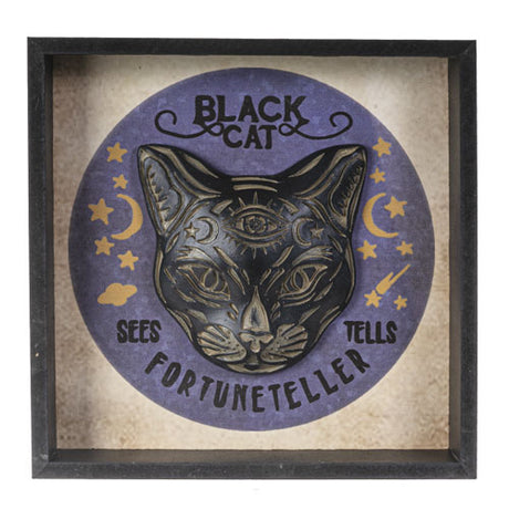 Framed artwork of a black cat with text 'Black Cat Sees Fortuneteller Tells' on a purple circle background.