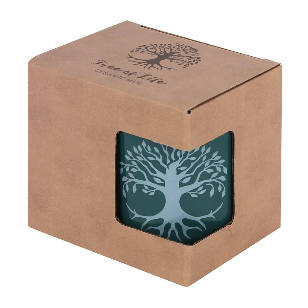 Green ceramic mug with silver-white tree of life design, shown in box