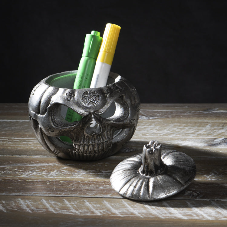 Silver-finished resin lidded jar, grinning jack-o-lantern pumpkin with arcane symbols, shown holding markers