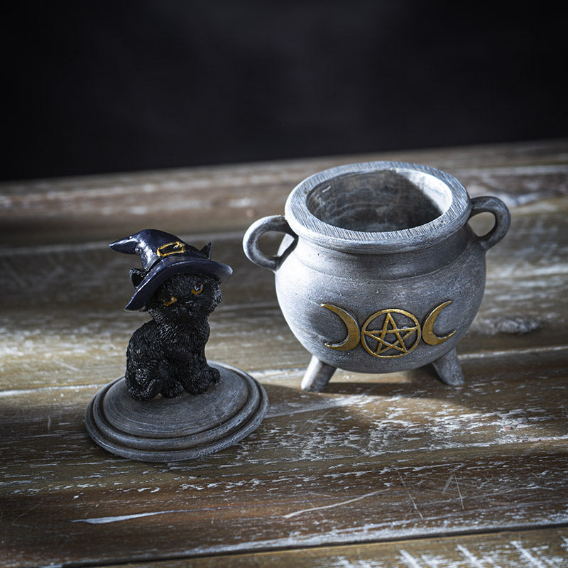 Trinket box of a gray cauldron with gold moon and pentagram, and cat in witch hat on the lid