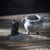 Trinket box of a gray cauldron with gold moon and pentagram, and cat in witch hat on the lid